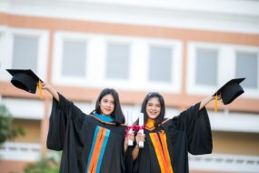 portrait-two-female-graduates-university-graduates-happily-holding-their-hats-up-front_43157-1258 portrait-two-female-graduates-university-graduates-happily-holding-their-hats-up-front_43157-1258