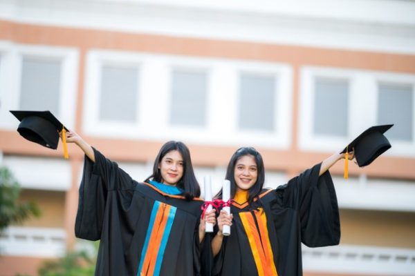 portrait-two-female-graduates-university-graduates-happily-holding-their-hats-up-front_43157-1258 portrait-two-female-graduates-university-graduates-happily-holding-their-hats-up-front_43157-1258