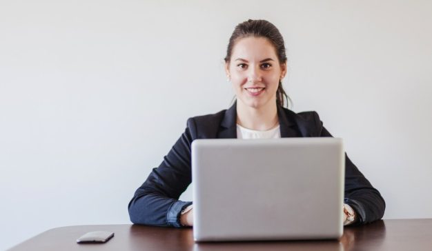 woman-sitting-desk-working-laptop_23-2147650965